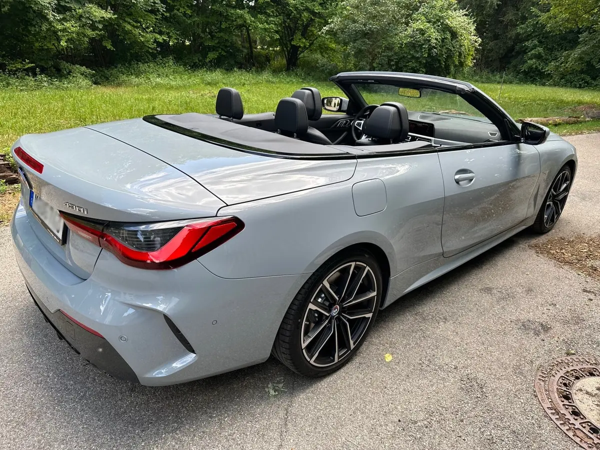 BMW 430i Cabrio 2023, exterior — Marbella Luxury Car Rental, Marbella. The 2023 BMW 430i Cabrio pairs a 245 hp turbocharged engine with a folding soft top,…