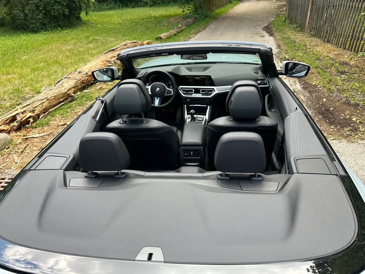 BMW 430i Cabrio 2023, rear view — Marbella Luxury Car Rental, Marbella. The 2023 BMW 430i Cabrio pairs a 245 hp turbocharged engine with a folding soft top,…