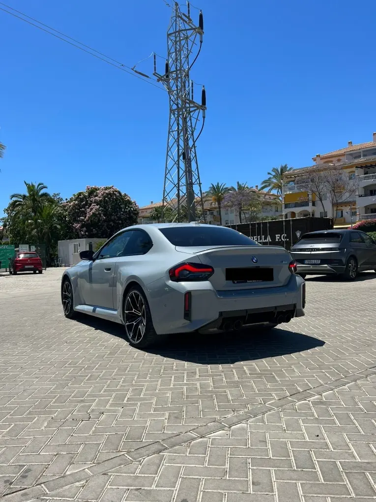 BMW M2 2024, exterior — Marbella Luxury Car Rental, Marbella. The 2024 BMW M2 is the compact end of the M lineup, but 460 hp through a chassis this…