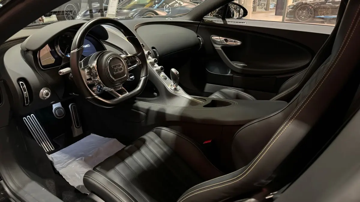Bugatti Chiron 110 Ani 2019, interior — Marbella Luxury Car Rental, Marbella. The Bugatti Chiron 110 Ans Bugatti is not a car you drive so much as an event you…