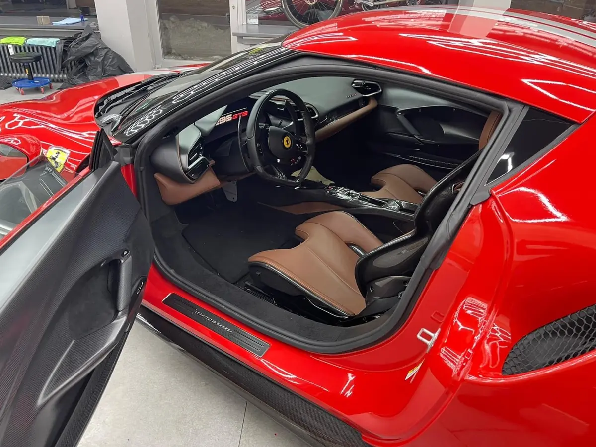 Ferrari 296 GTB 2023, rear view — Marbella Luxury Car Rental, Marbella. The Ferrari 296 GTB is built around a two-seat cockpit and 830 hp, numbers that translate…