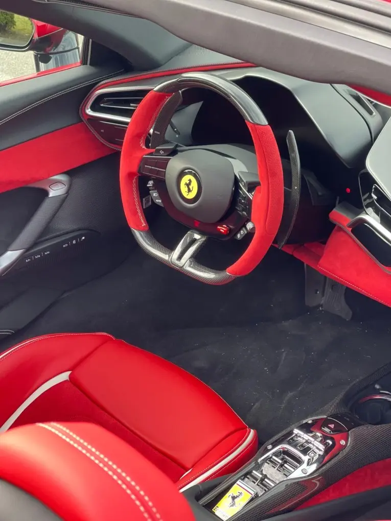 Ferrari 296 GTS Spider 2025, interior — Marbella Luxury Car Rental, Marbella. The Ferrari 296 GTS Spider puts 819 hp behind two seats and a folding roof, which is a…