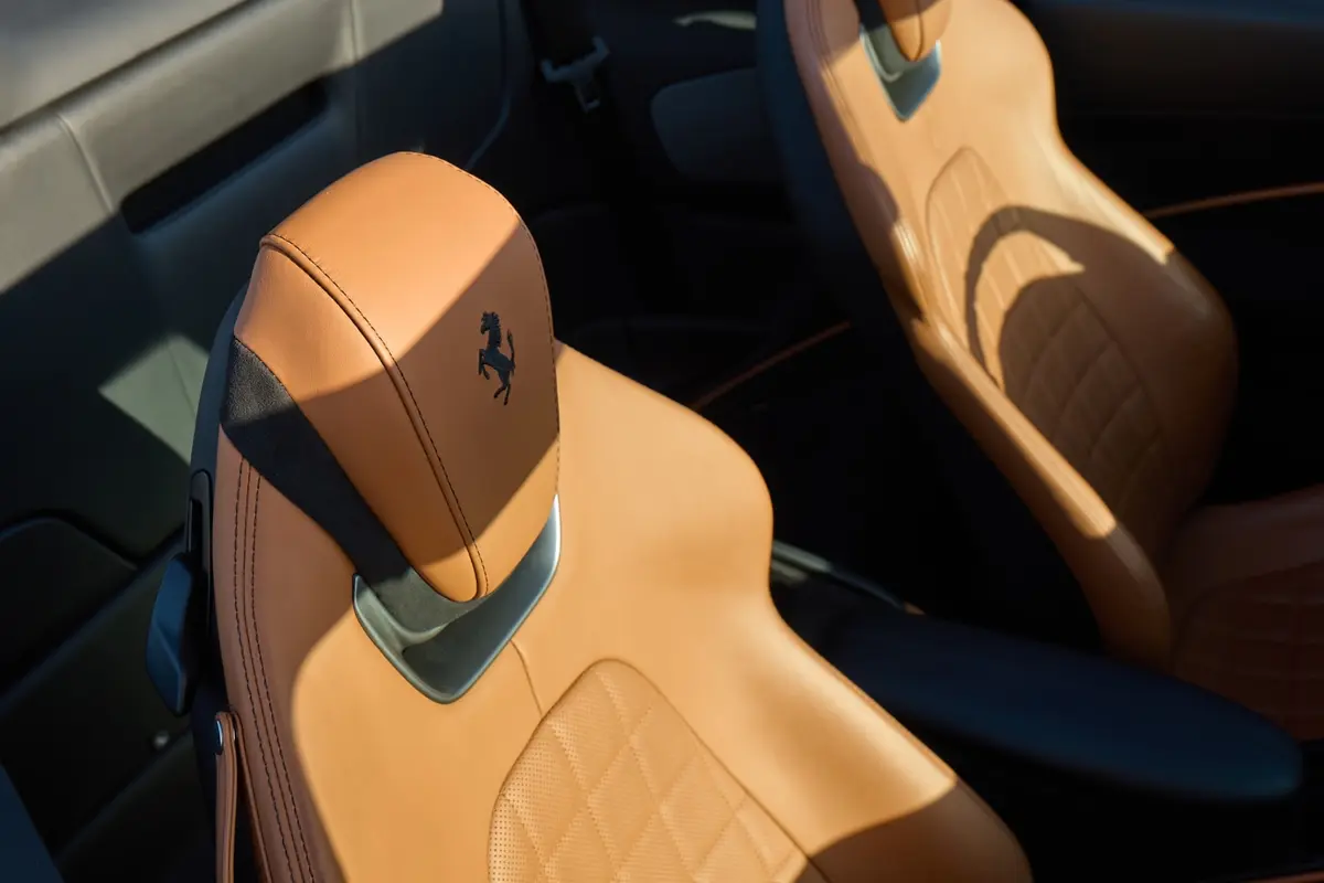 Ferrari Roma Spider 2024, interior — Marbella Luxury Car Rental, Marbella. The Ferrari Roma Spider pairs a front-mounted V8 producing 620 hp with a folding soft-top…