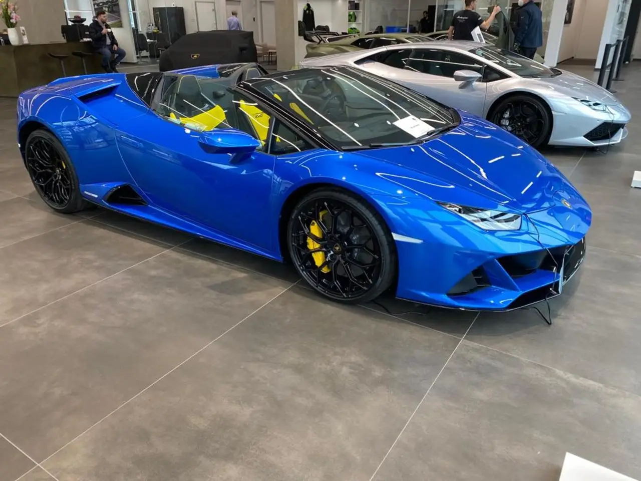 Lamborghini Huracan Evo Spyder 2022, front view — Marbella Luxury Car Rental, Marbella. The Lamborghini Huracan Evo Spyder pairs a 640 hp naturally-derived V10 with a folding…