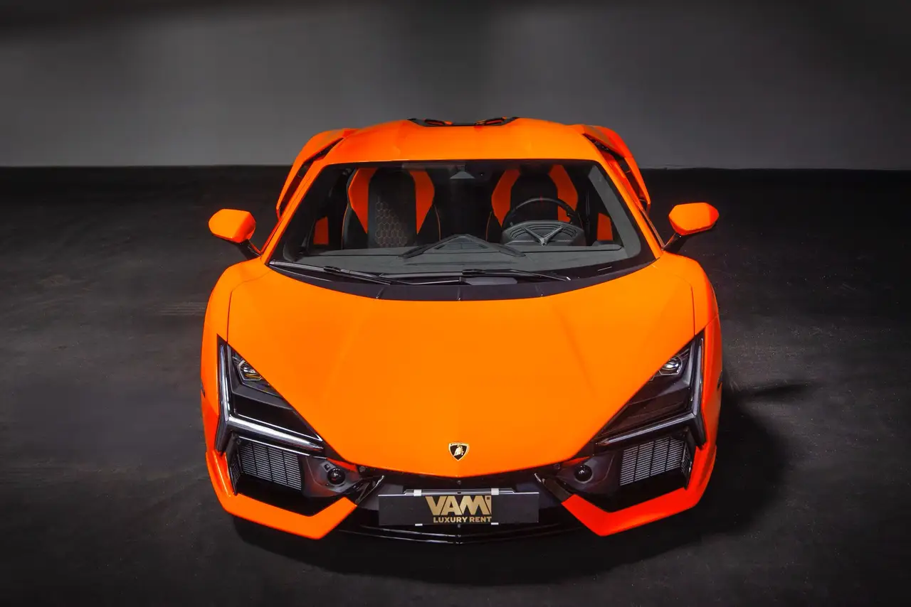 Lamborghini Revuelto 2026, rear view — Marbella Luxury Car Rental, Marbella. The Lamborghini Revuelto is Lamborghini's first V12 hybrid, and the number that matters…