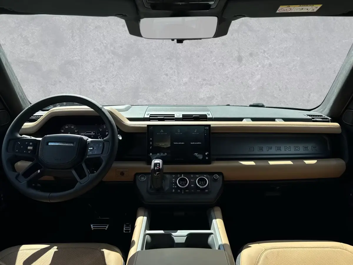 Land Rover Defender 2024, rear view — Marbella Luxury Car Rental, Marbella. The 2024 Land Rover Defender pairs 400 hp with genuine seven-seat capacity, which changes…