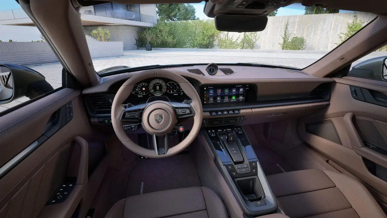 Porsche 911 992 Carrera Turbo S Cabrio 2026, rear view — Marbella Luxury Car Rental, Marbella. The 992-generation 911 Carrera Turbo S Cabrio puts 650 hp behind a roof that folds away…