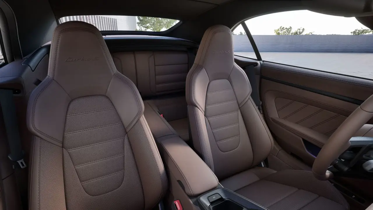 Porsche 911 992 Carrera Turbo S Cabrio 2026, interior — Marbella Luxury Car Rental, Marbella. The 992-generation 911 Carrera Turbo S Cabrio puts 650 hp behind a roof that folds away…