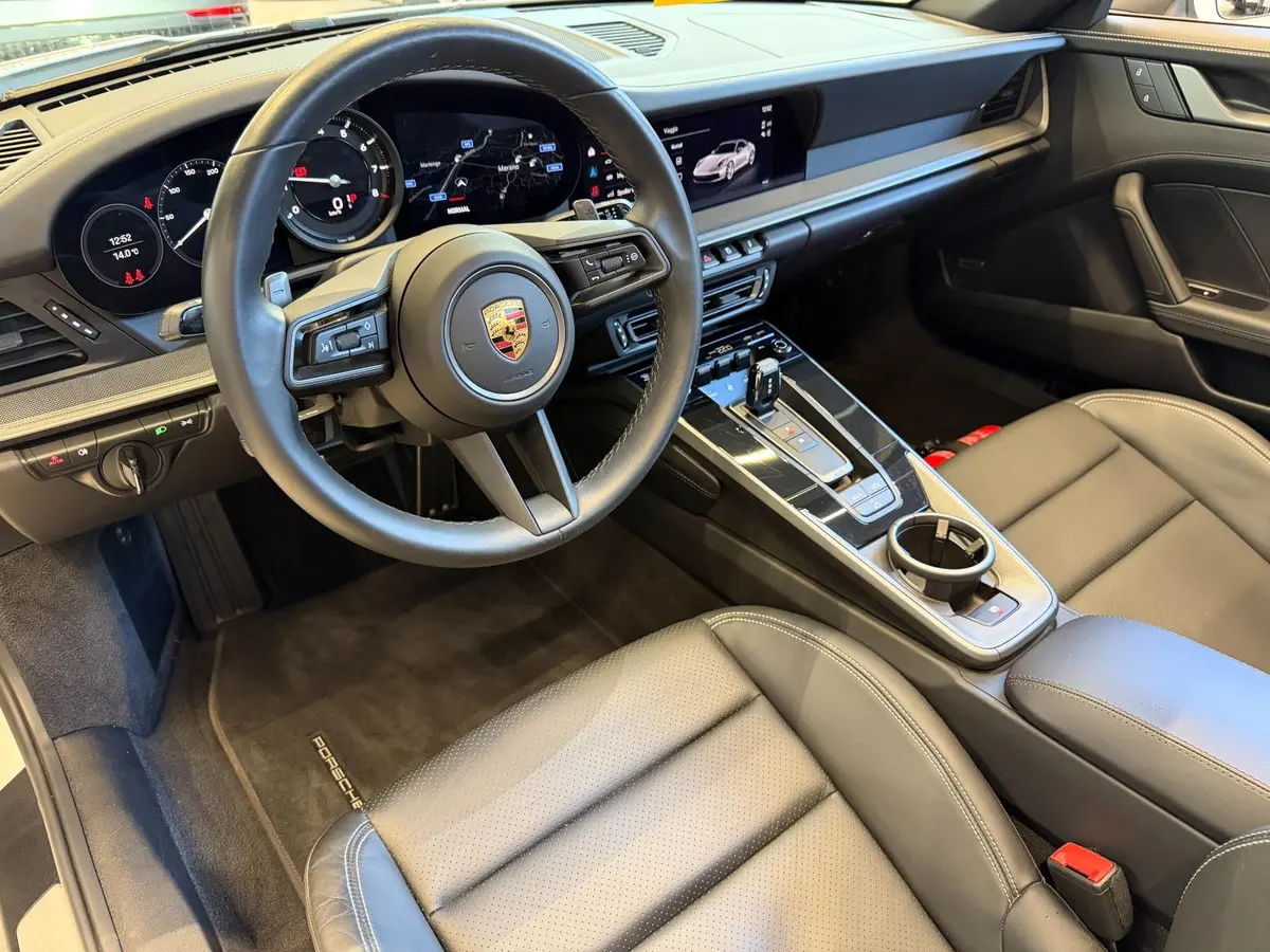 Porsche 911 Carrera S Cabrio (992) 2025, front view — Marbella Luxury Car Rental, Marbella. The 2025 Porsche 911 Carrera S Cabrio (992) is the kind of car that rewards a good road…