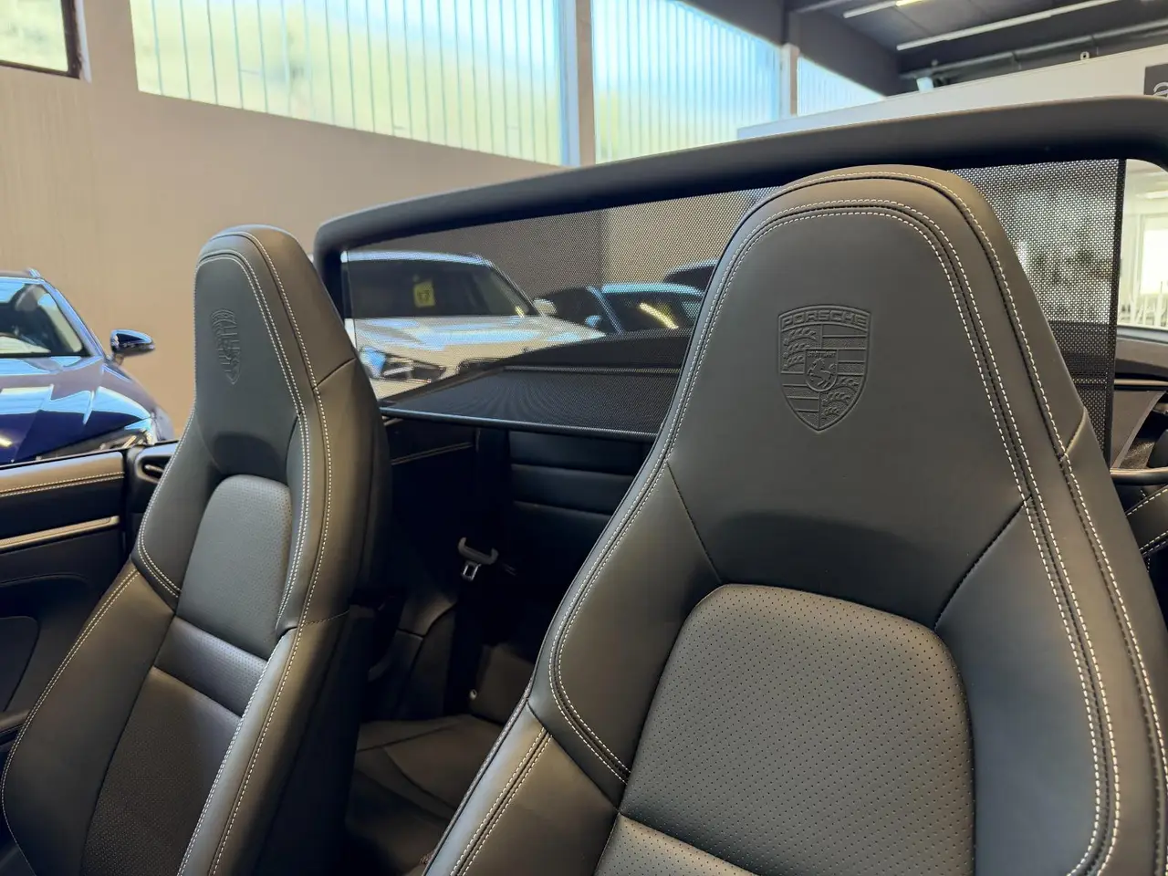 Porsche 911 Carrera S Cabrio (992) 2025, rear view — Marbella Luxury Car Rental, Marbella. The 2025 Porsche 911 Carrera S Cabrio (992) is the kind of car that rewards a good road…