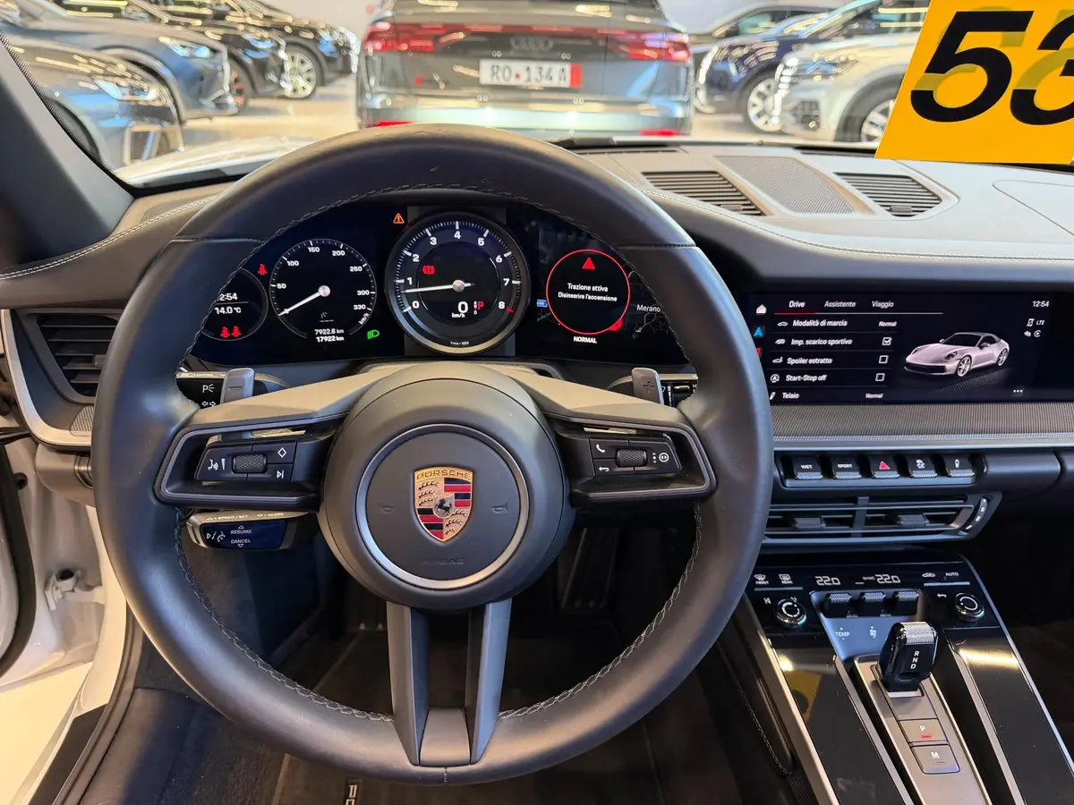 Porsche 911 Carrera S Cabrio (992) 2025, interior — Marbella Luxury Car Rental, Marbella. The 2025 Porsche 911 Carrera S Cabrio (992) is the kind of car that rewards a good road…