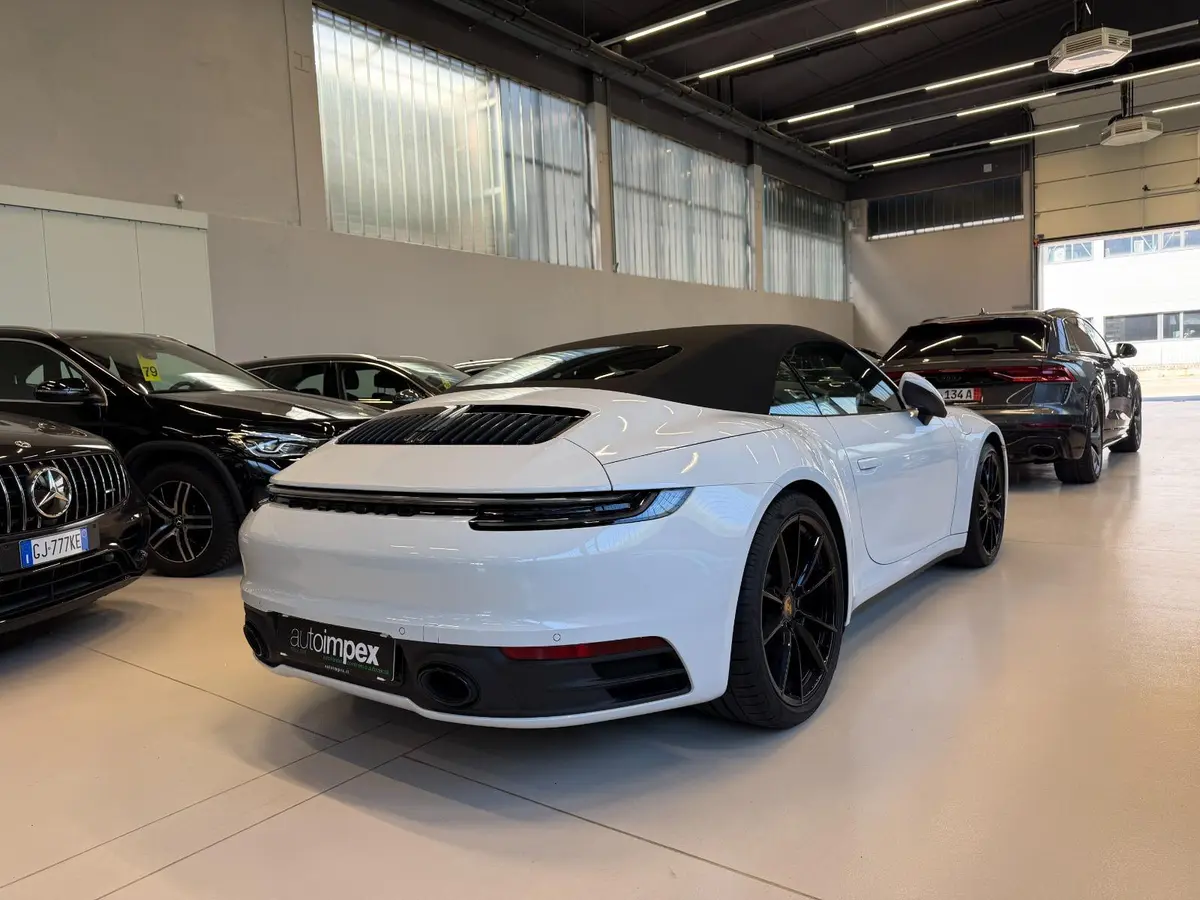 Porsche 911 Carrera S Cabrio (992) 2025, side profile — Marbella Luxury Car Rental, Marbella. The 2025 Porsche 911 Carrera S Cabrio (992) is the kind of car that rewards a good road…