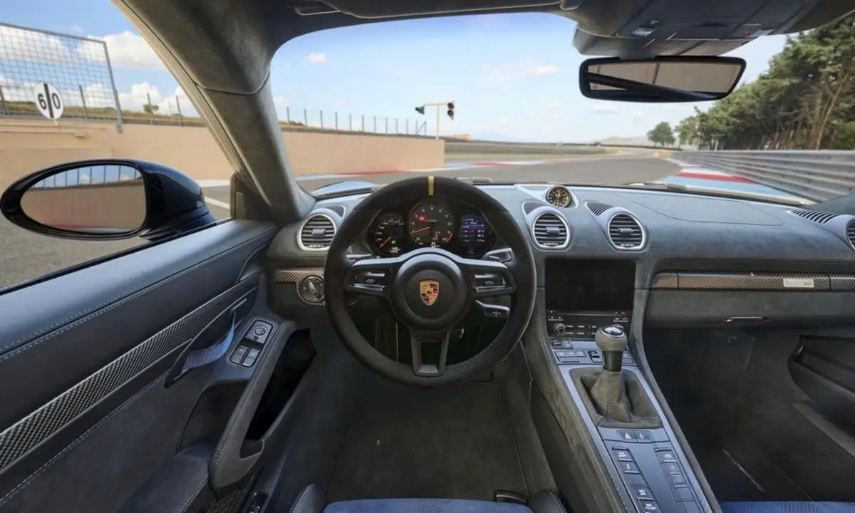 Porsche GT4 RS 2024, exterior — Marbella Luxury Car Rental, Marbella. The Porsche GT4 RS is not a car for idle cruising — it's built around its engine, a…
